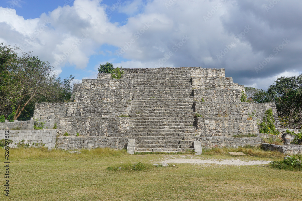 Dzibilchaltun, Yucatan, Mexico: Structure 36, a tiered pyramid with a central stairway, on the northeast corner of the main plaza. Dzibilchaltun, Yucatan, Mexico: Structure 36, a tiered pyramid with a central stairway, on the northeast corner of the main plaza.