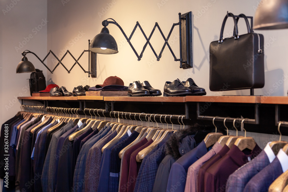 Closeup colorful male, female clothes, shoes in boutique hanging on  hangers, clothing rack. Concept opening luxury shop, shopping mall, store  sale, retail fashion store, second hand outlet. Stock Photo | Adobe Stock