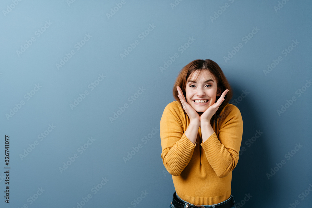 Cute funny young woman grinning at the camera Cute funny young woman grinning at the camera