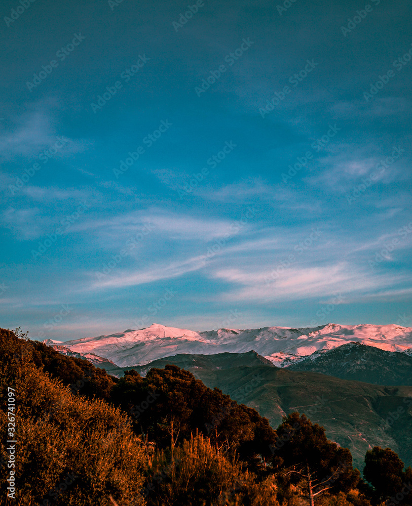 Sierra Nevada sunset with the Veleta peak and the ski slopes of Prado Llano