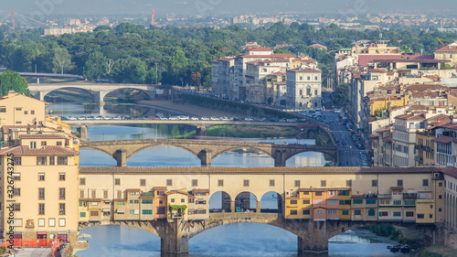 View on The Ponte Vecchio early morning timelapse, a medieval stone segmental arch bridge over the Arno River, in Florence, Italy