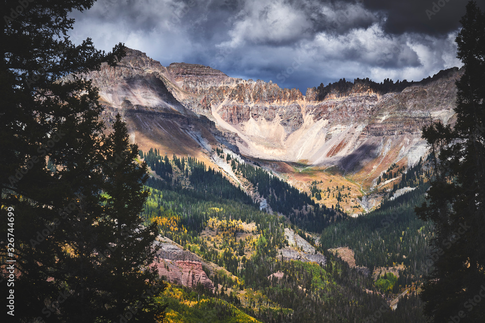 a dramatic mountain scene with storm clouds in Colorado