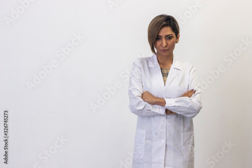 Portrait of angry latin young woman model Doctor, nurse, pharmacist, beauty therapist, scientist, ophthalmologist, optometrist, beautician, healthcare, isolated on white background studio shot, in whi