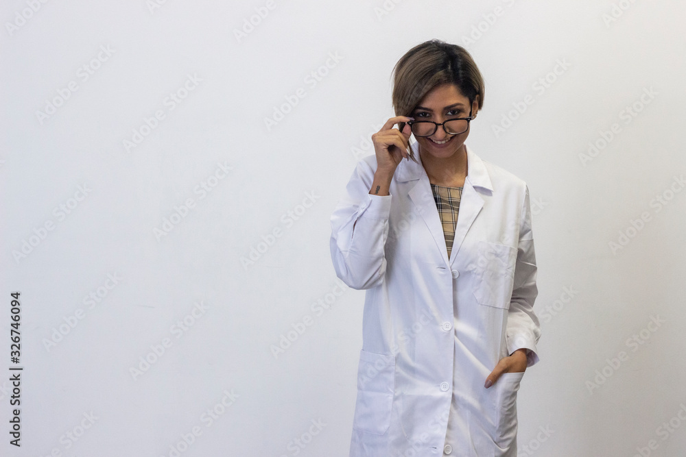 Portrait of pretty young woman taking off eyeglasses, holding frames near forehead as gazing at camera. Pharmacist, therapist, doctor, nurse, scientist, optometrist, isolated on white background studi Portrait of pretty young woman taking off eyeglasses, holding frames near forehead as gazing at camera. Pharmacist, therapist, doctor, nurse, scientist, optometrist, isolated on white background studi