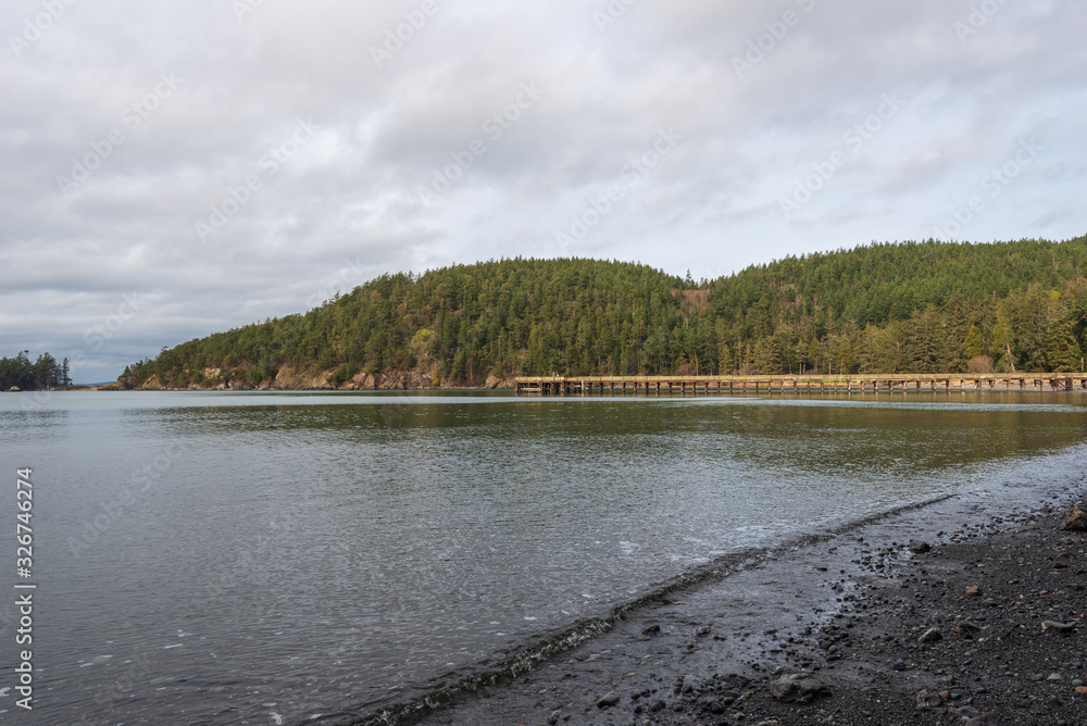 Landscape of beach, and forested hills at Bowman Bay in Washington