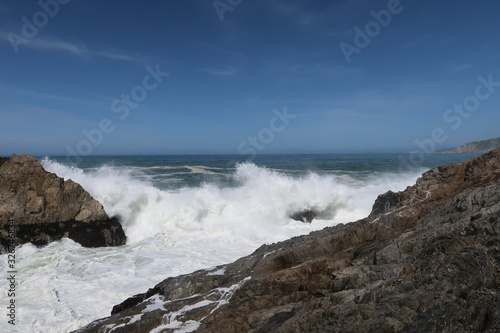 Landscape of rocks and waves on the Pacific Ocean at Point Reyes National Seashore in California