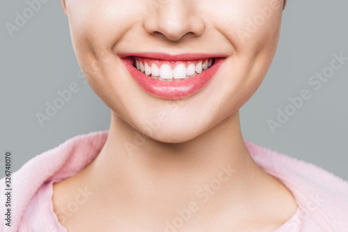 closeup of smile with white healthy teeth.
