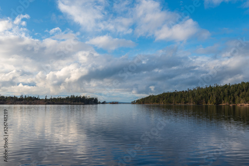 Landscape of ocean bay and distant forest at Deception Pass State Park in Washington