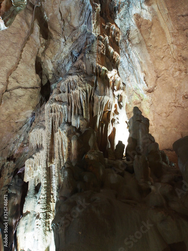 Under the ground. Beautiful view of stalactites and stalagmites in an underground cave-Skelskaya cave, South-West of Crimea. Speleology, the concept of active recreation, extreme travel.