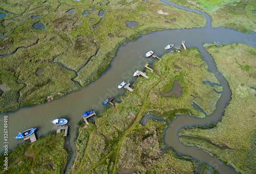 Boats in a tidal harbor, Aerial photo Norfolk. Thornham.  Green, summer sunny. photo