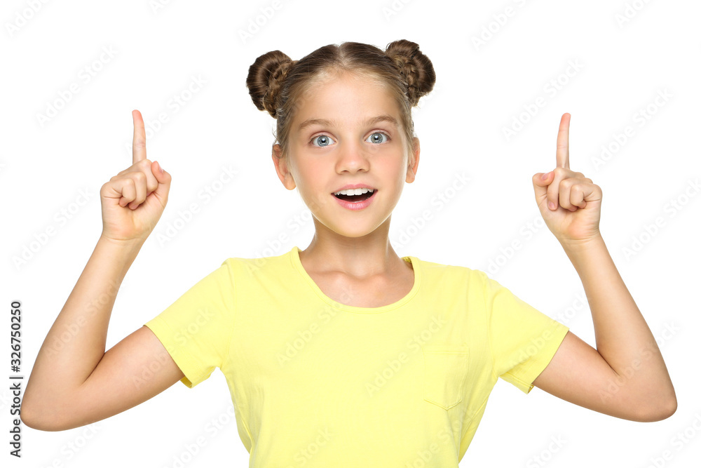 Young beautiful girl pointing fingers up on white background Young beautiful girl pointing fingers up on white background