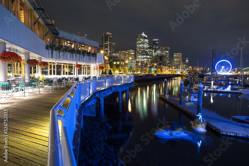 Seattle waterfront at night, contrasting colours, skyscrapers 