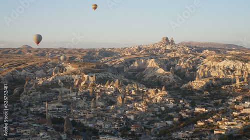 Flight in a hot air balloon over Goreme town with a spectacular aerial panoramic view to the Cappadocia landscape in Central Anatolia, Turkey. 