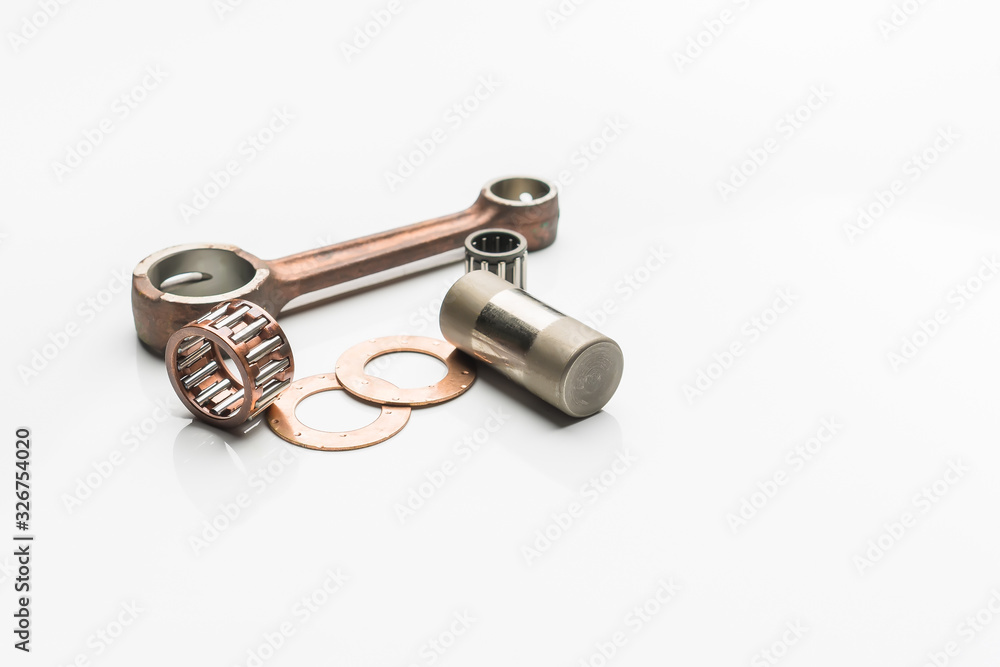 ball bearing and piston rod on a white background .selective focus on  bearing