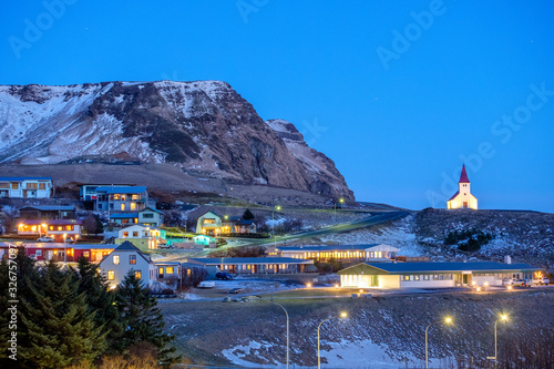 Vik, Iceland: night skyline with a church on the hill