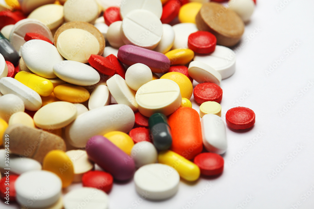 Different colorful tablets at white background Different colorful tablets at white background