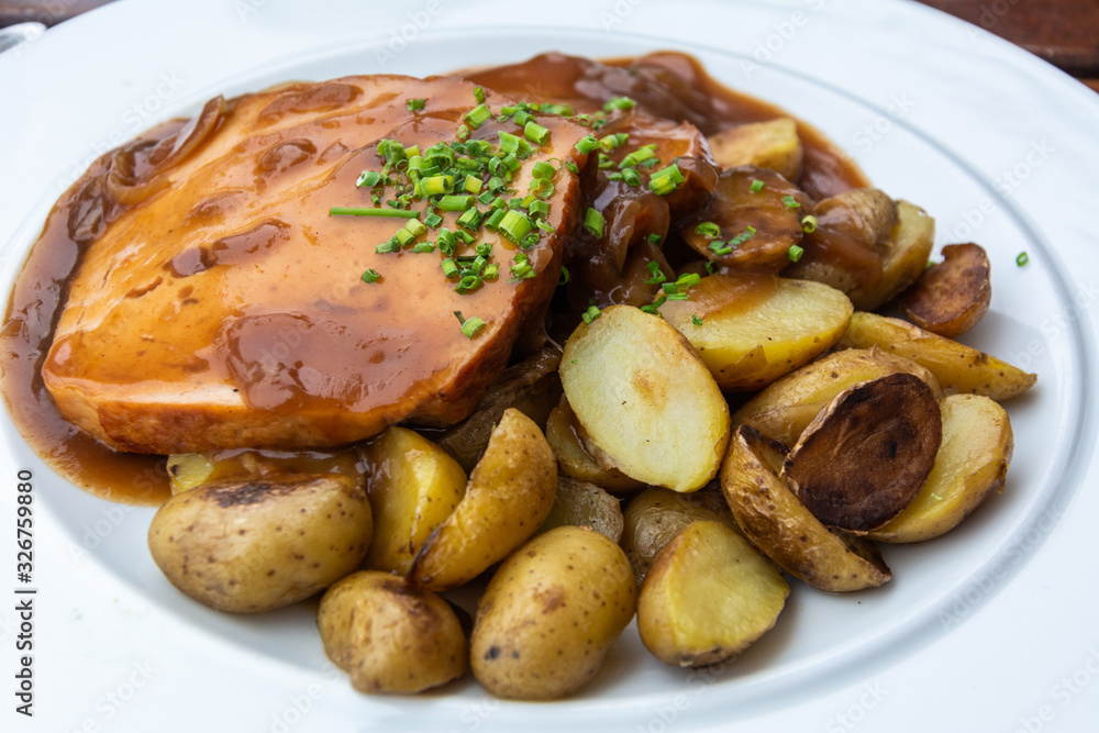 Bavarian fine meatloaf with onion sauce and roast potatoes Bavarian fine meatloaf with onion sauce and roast potatoes