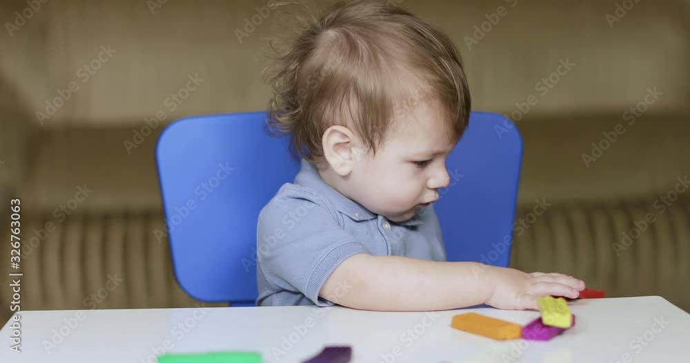 Child playing with plasticine colorful
