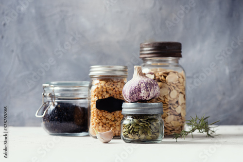 Zero waste household, jars for dry food. Lentil, seeds, grains in glass containers.