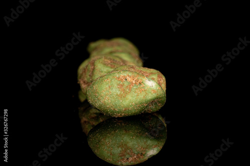 Lot of whole wasabi green peanut isolated on black glass