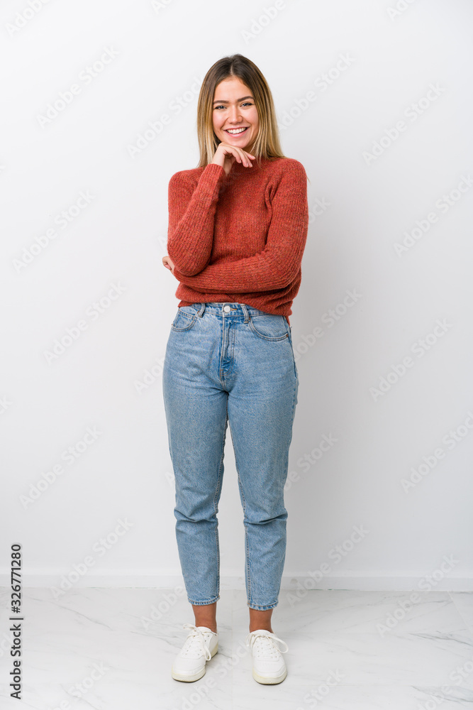 Full body young caucasian woman smiling happy and confident, touching chin with hand. Full body young caucasian woman smiling happy and confident, touching chin with hand.