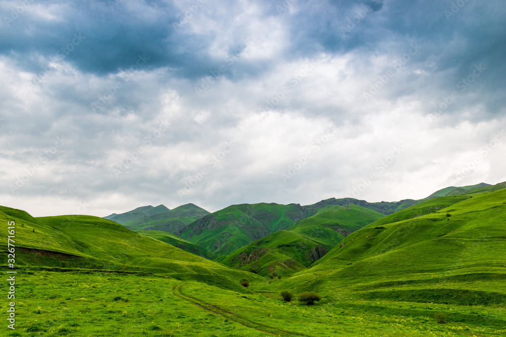 Scenic beautiful high mountains of the Caucasus, clouds over the mountains, the landscape of Armenia