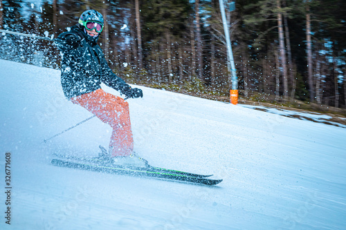 Young skier enjoying his time on skis photo