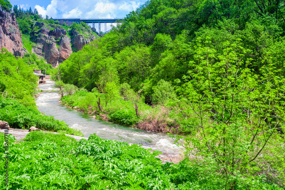 Bridge in Jermuk city, view of the river at the waterfall, Armenia Bridge in Jermuk city, view of the river at the waterfall, Armenia