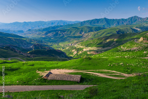 Armenia's high mountains covered with grass, summer landscape with a view of the horizon