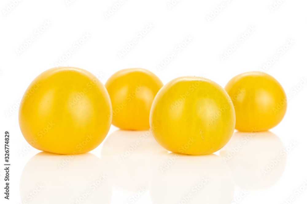 Group of four whole fresh yellow tomato isolated on white background Group of four whole fresh yellow tomato isolated on white background