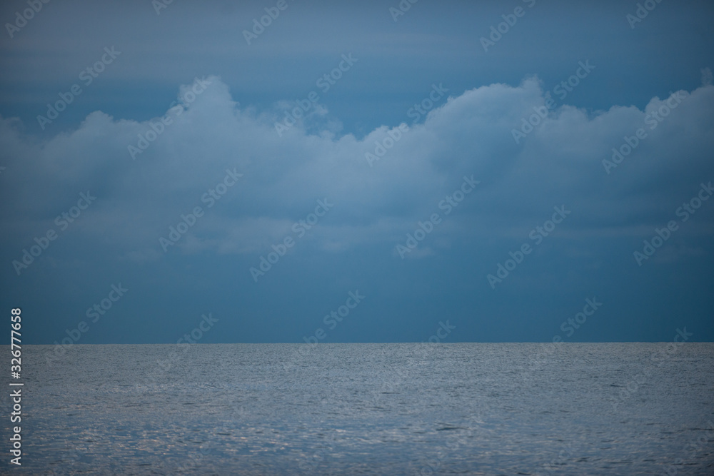  ocean with cloudy sky