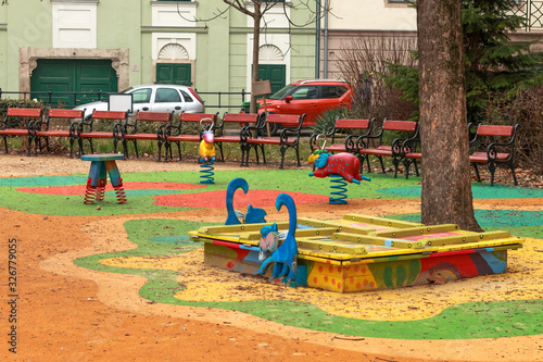 a empty public colorful outdoor playground for small children in a center of Budapest