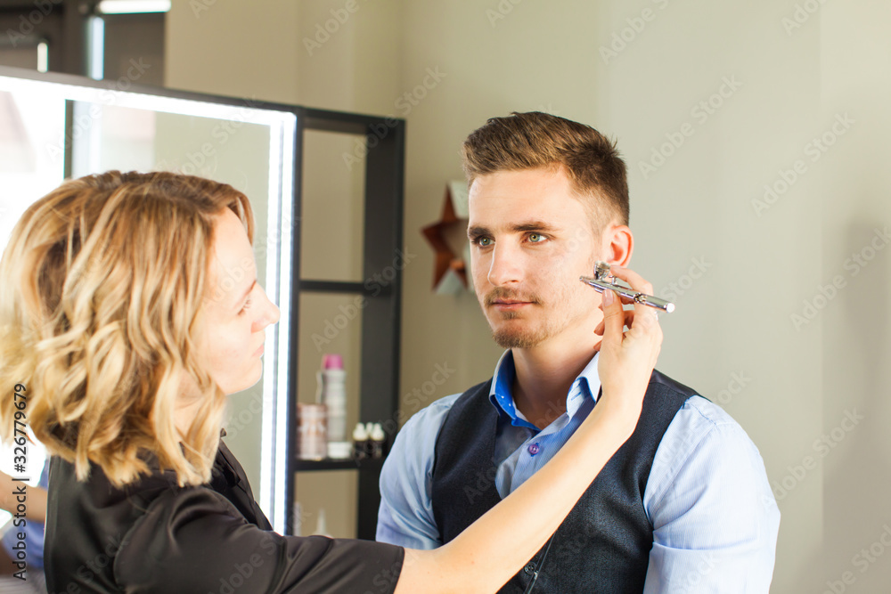 Visagiste at work is doing glamour model makeup Visagiste at work is doing glamour model makeup