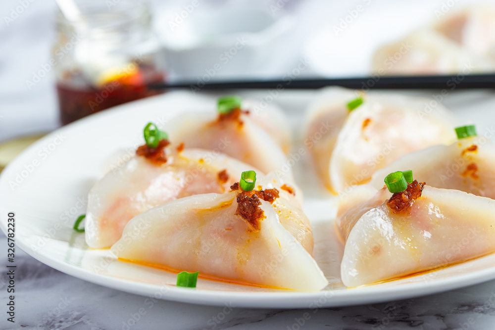 Crystal dumplings with jicama fiiling, served with XO sauce Crystal dumplings with jicama fiiling, served with XO sauce