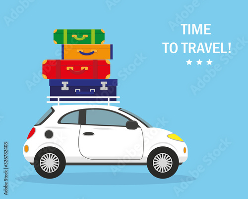 White car with suitcases on the roof.