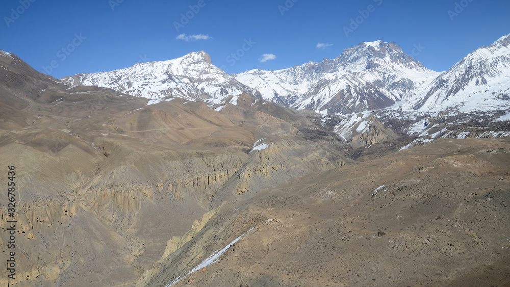 High mountainous landscape. View at Gandhaki river gorge and surrounding mountains. Mustang district, Nepal.
