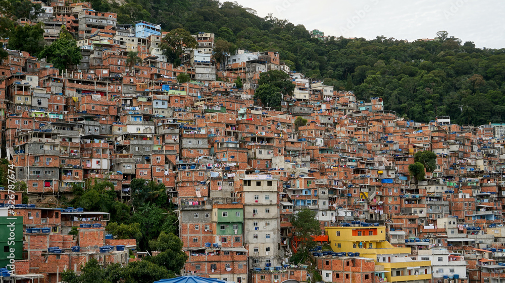 Rocinha is the largest favela in Brazil, located in Rio de Janeiro's South Zone between the districts of São Conrado and Gavea. 