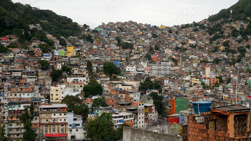Rocinha is the largest favela in Brazil, located in Rio de Janeiro's South Zone between the districts of São Conrado and Gavea. 