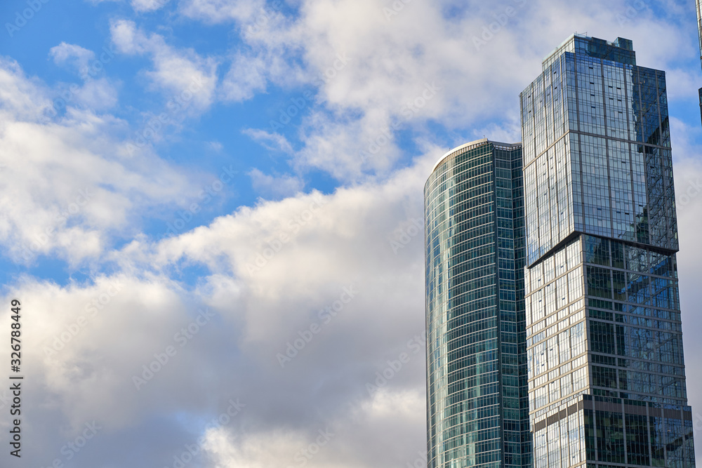 Glass skyscrapers of the Moscow City and beautiful clouds in the background, Russia. 