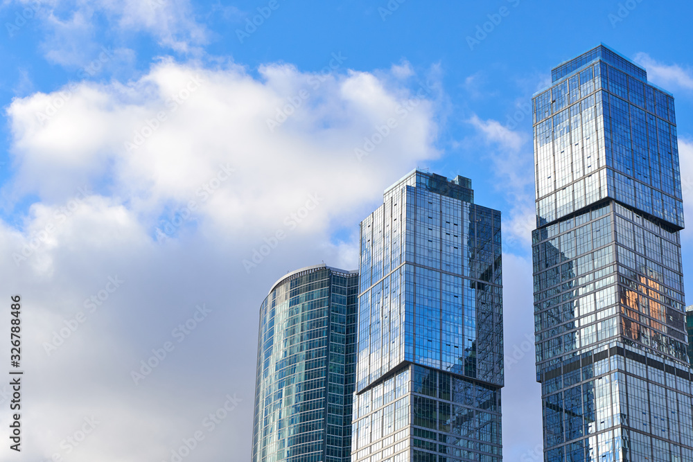 Glass skyscrapers of the Moscow City and beautiful clouds in the background, Russia. 