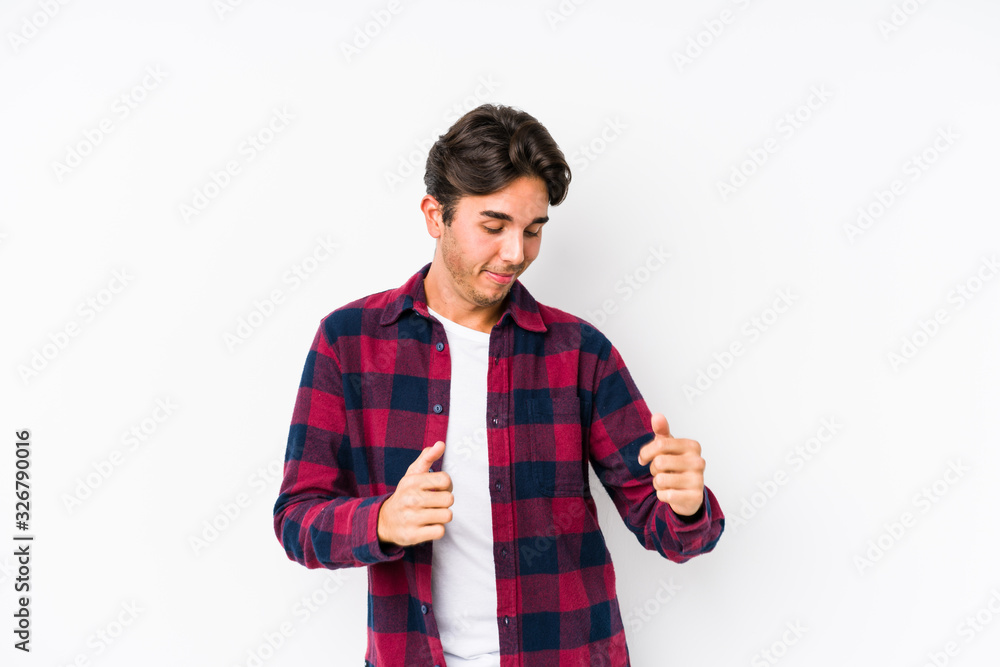 Young caucasian man posing in a pink background isolated dancing and having fun. Young caucasian man posing in a pink background isolated dancing and having fun.