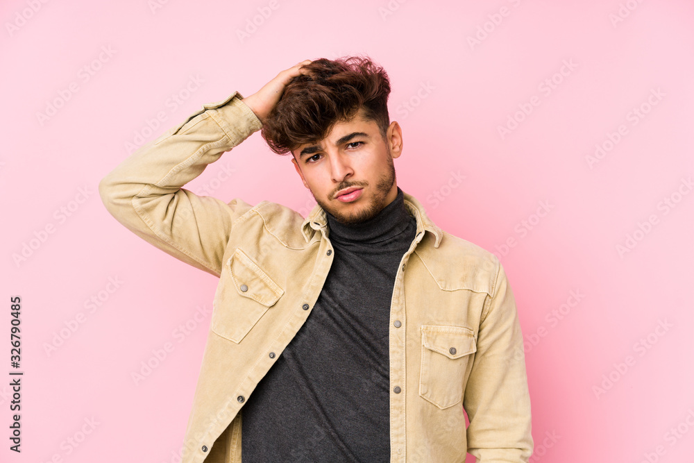 Young arabian man posing in a background isolated being shocked, she has remembered important meeting. Young arabian man posing in a background isolated being shocked, she has remembered important meeting.