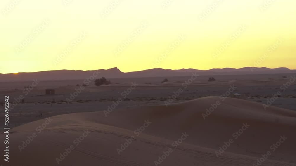 warm colors sunrise on the sahara desert, golden hour in merzouga, morocco warm colors sunrise on the sahara desert, golden hour in merzouga, morocco