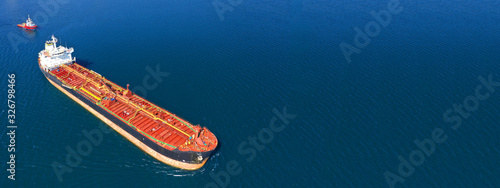 Photography Aerial drone ultra wide photo of fuel tanker ship docked in Mediterranean bay