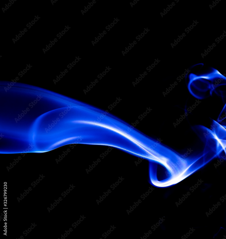 Blue smoke on black background