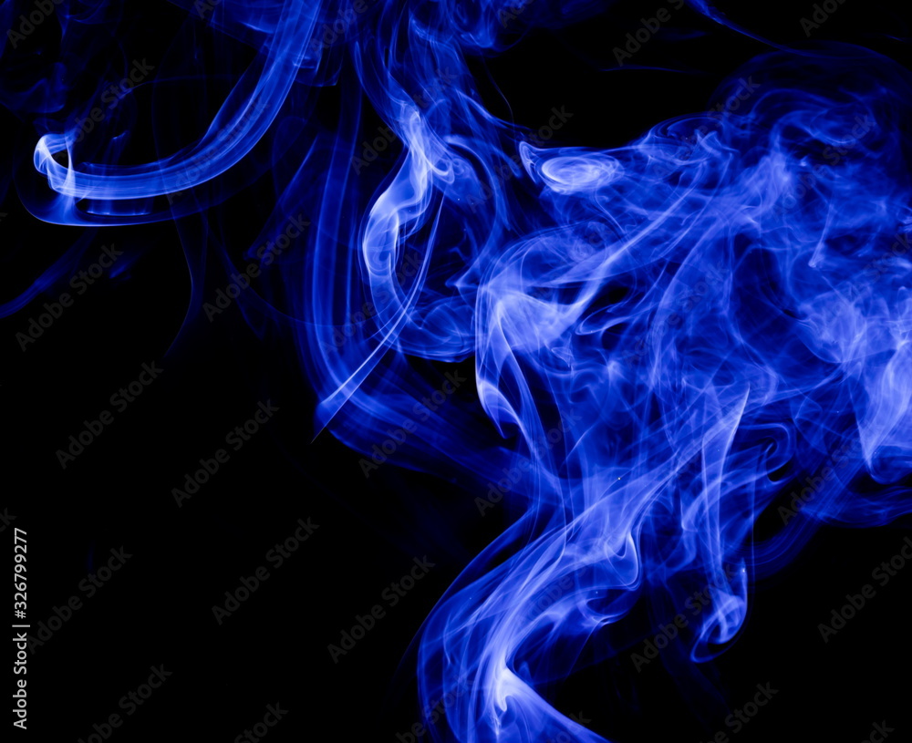 Fototapeta premium Blue smoke on black background