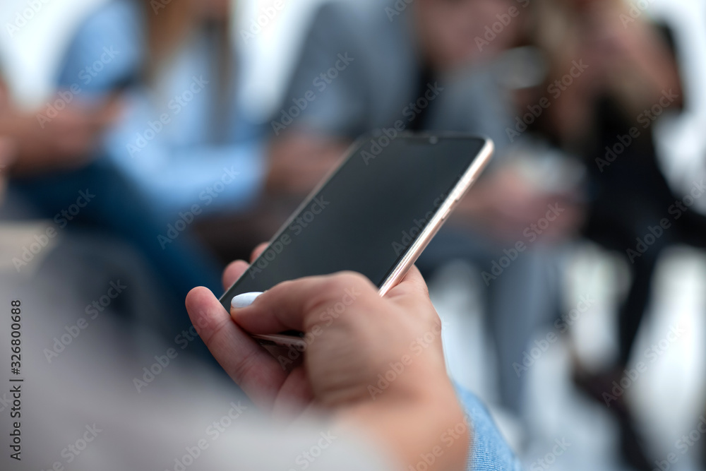 close up. casual guy looking at the screen of his smartphone