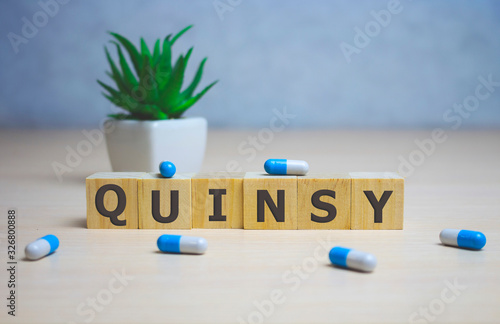 quinsy word on wooden cubes. quinsy concept. medical concept photo