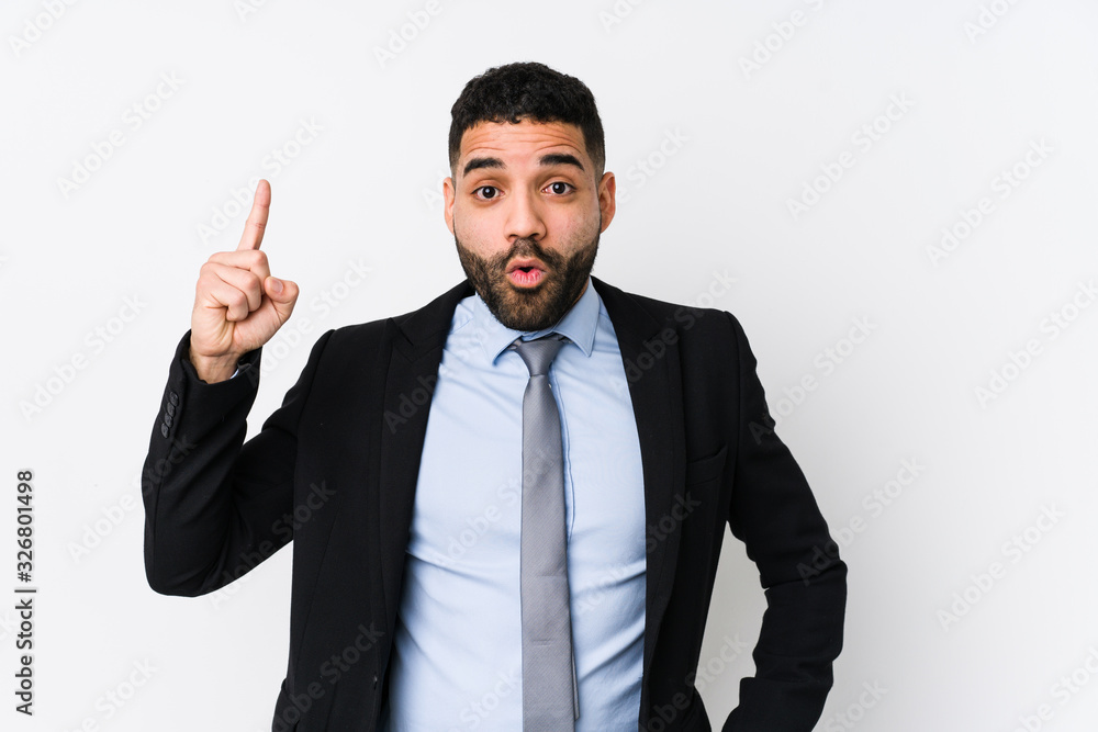 Young latin business woman against a white background isolated having some great idea, concept of creativity. Young latin business woman against a white background isolated having some great idea, concept of creativity.