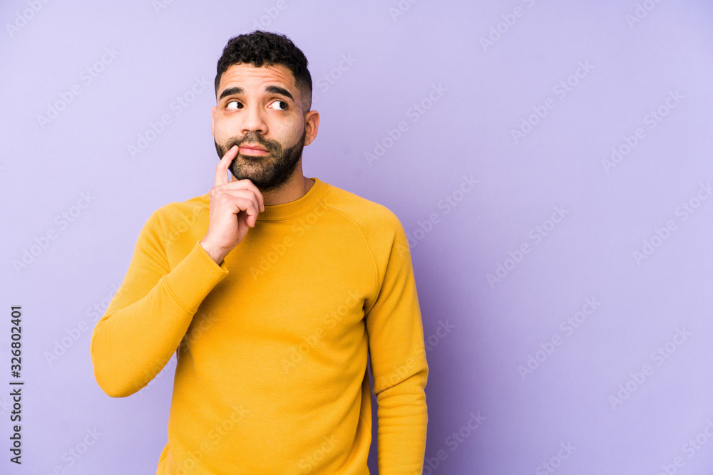 Young mixed race arabic man isolated looking sideways with doubtful and skeptical expression. Young mixed race arabic man isolated looking sideways with doubtful and skeptical expression.